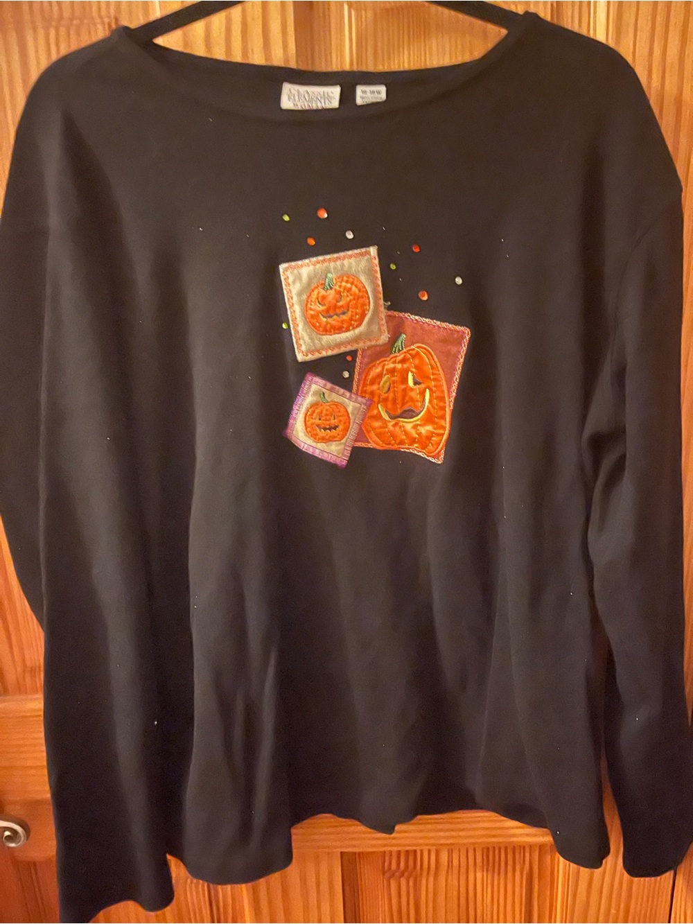 Classic Elements Black Crewneck Sweater with Embroidered Orange Pumpkin Motifs